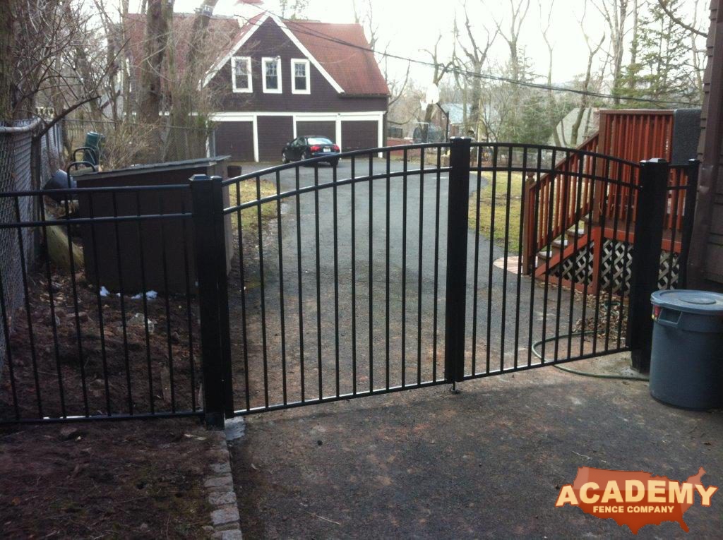 This is a continuous arched Aluminum Driveway Gate installed at a residential property in South Orange, NJ