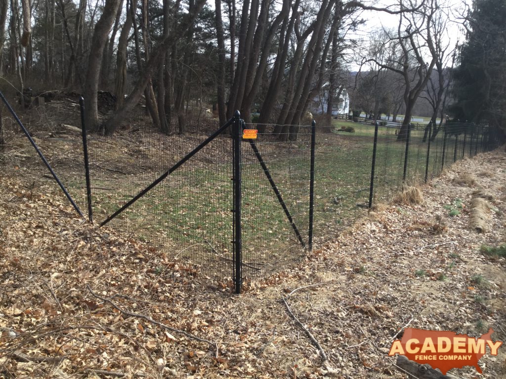 8' high black wire deer fence installed in Essex Fells NJ, by Academy Fence Company.