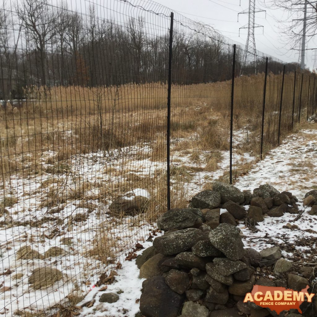 8′ high black wire deer fence installed in Glen Ridge NJ, by Academy Fence Company.