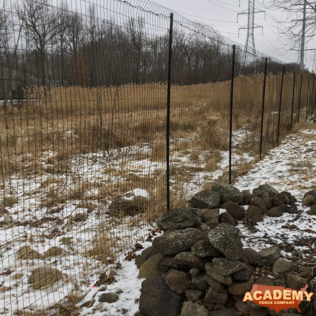 8′ black wire deer fence installed in Livingston NJ, by Academy Fence Company.