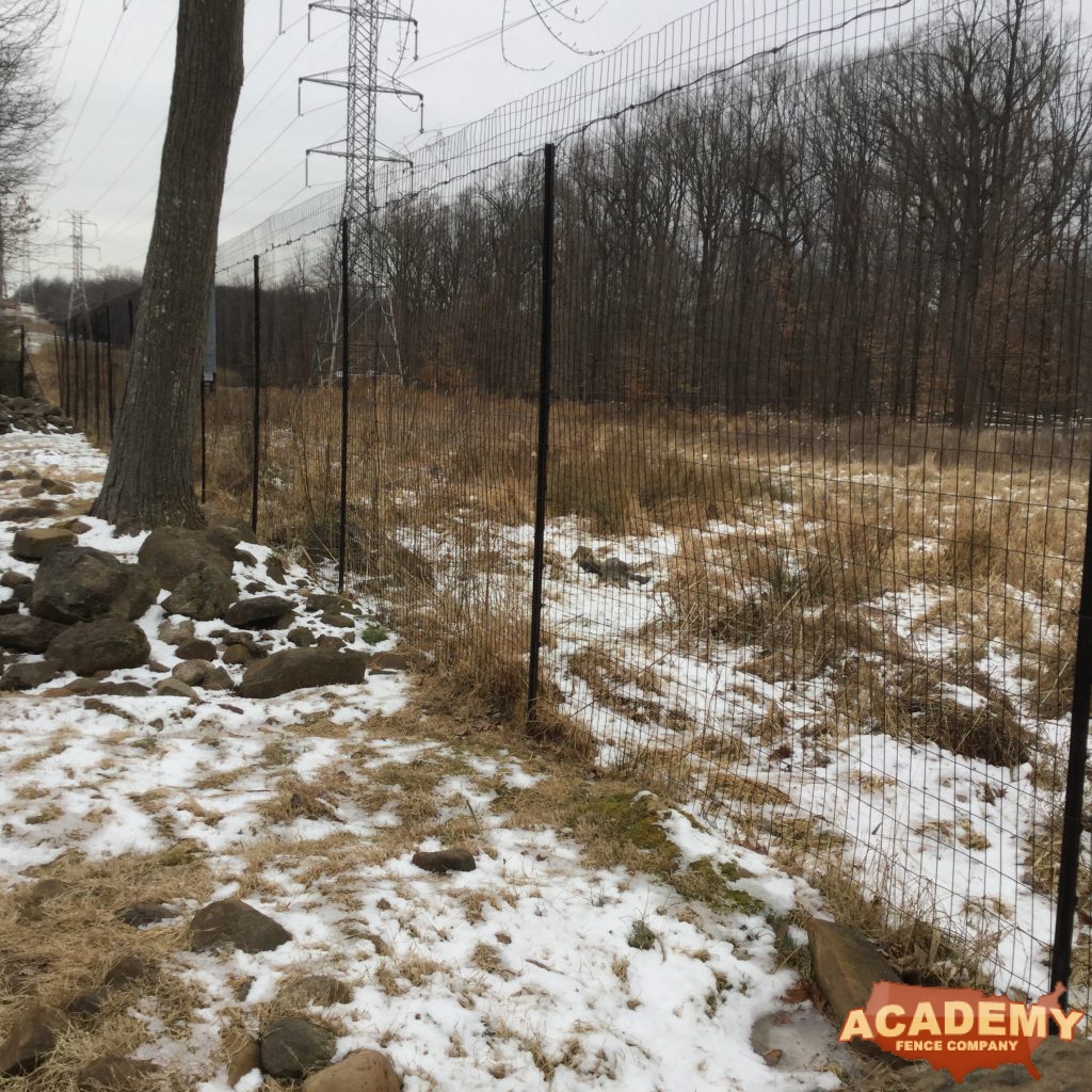 8′ black wire deer fence installed in Maplewood NJ, by Academy Fence Company.