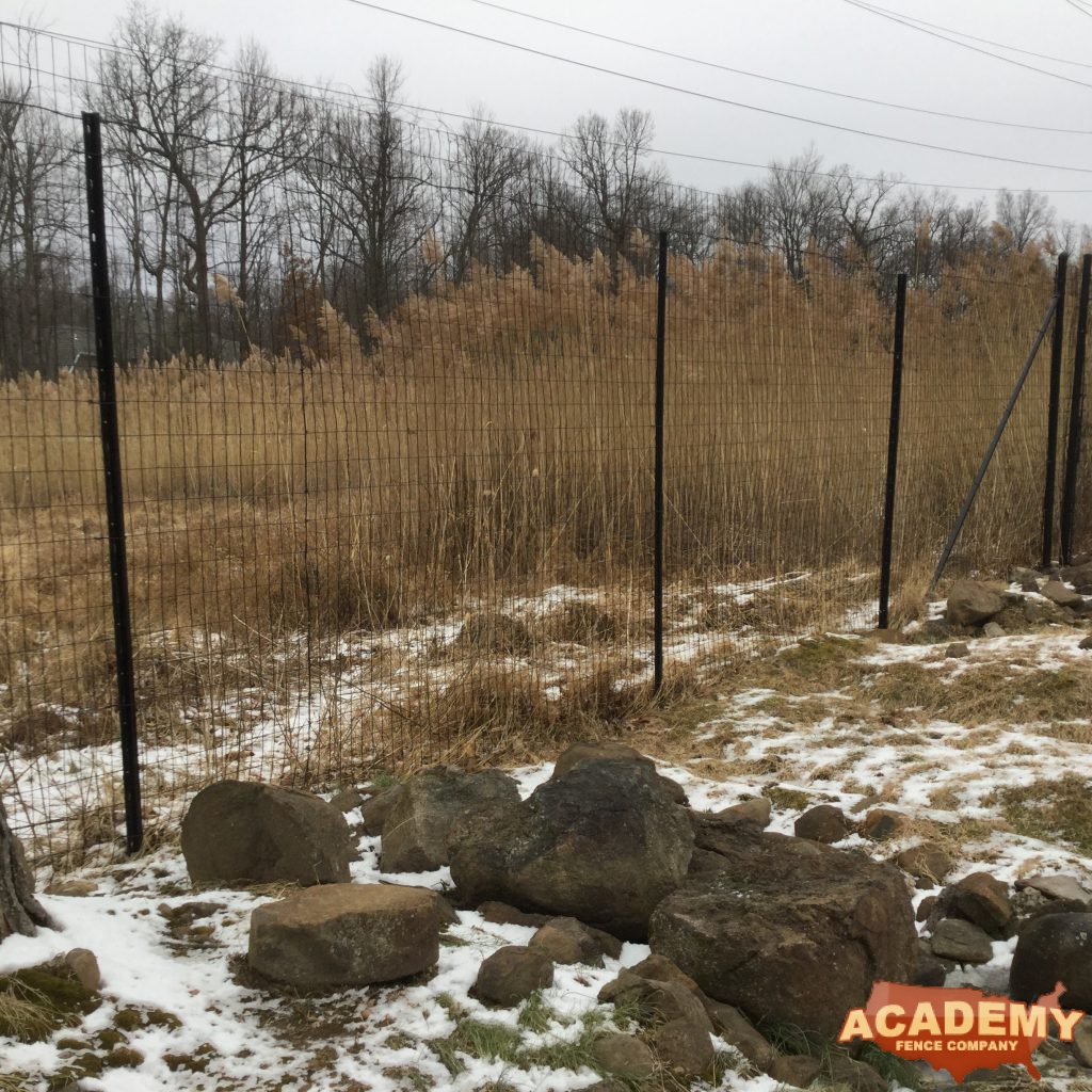 8′ black wire deer fence installed in Millburn NJ, by Academy Fence Company.