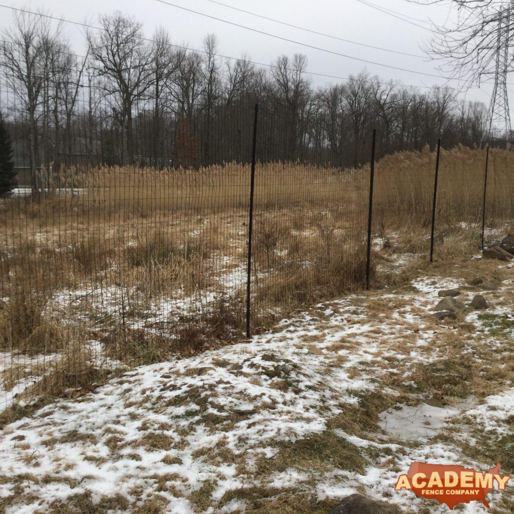 8′ black wire deer fence installed in Montclair NJ, by Academy Fence Company.