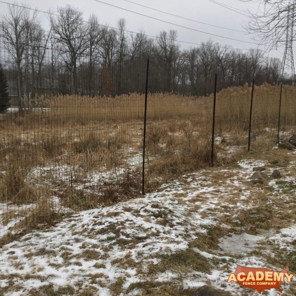 8′ black wire deer fence installed in Newark NJ, by Academy Fence Company.