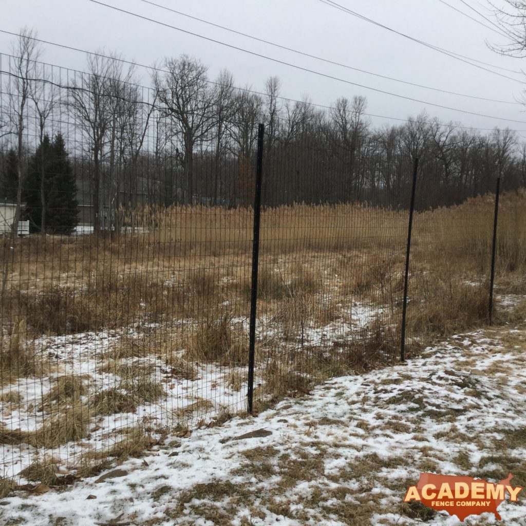 8′ black wire deer fence installed in West Caldwell NJ, by Academy Fence Company.