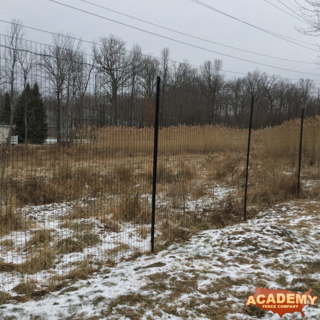 8′ black wire deer fence installed in West Orange NJ, by Academy Fence Company.