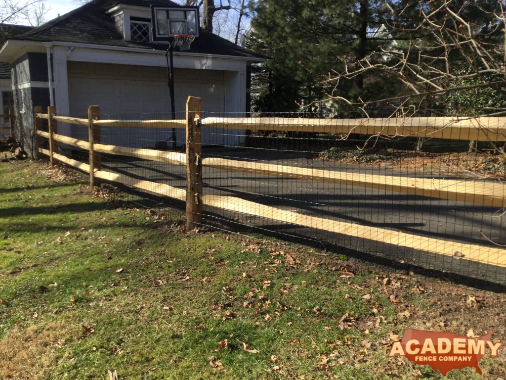 Post and rail with welded wire mesh attached, installed by Academy Fence Company in Caldwell, NJ, Essex County.