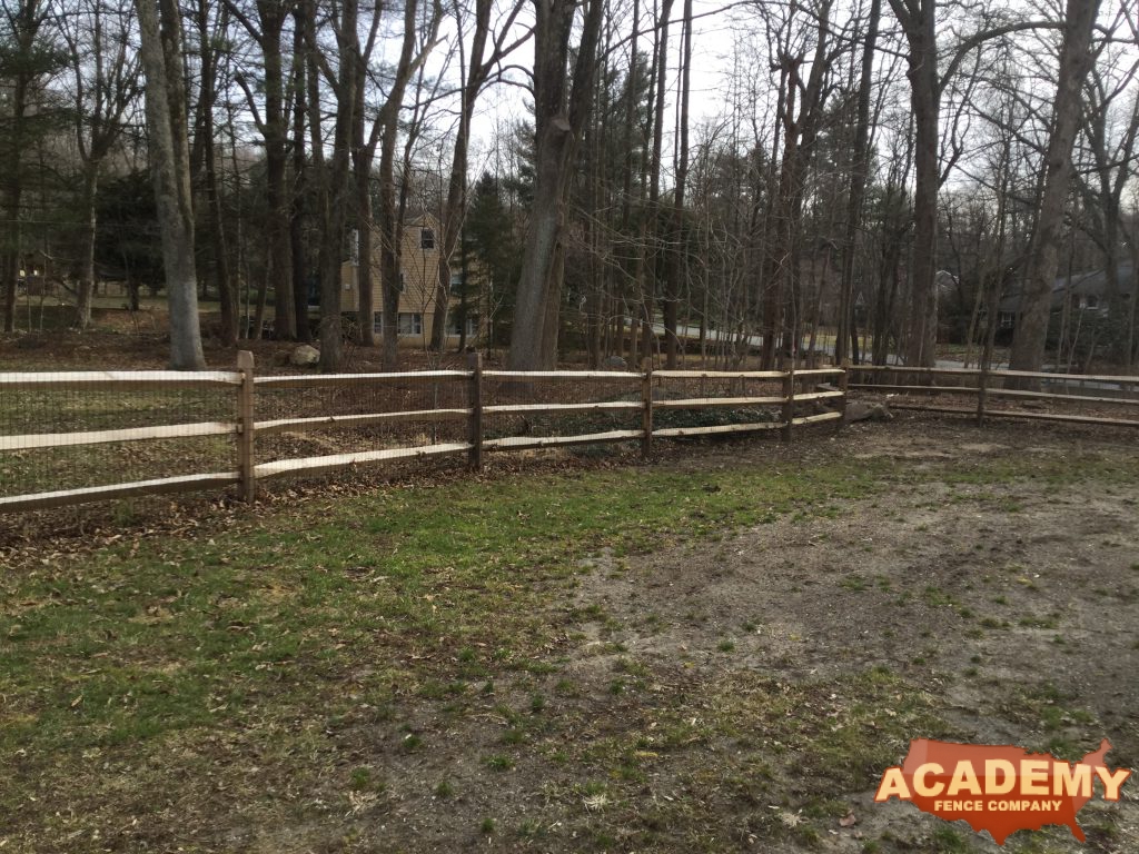 Post and rail with welded wire mesh attached installed by Academy Fence Company in Millburn, NJ, Essex County.