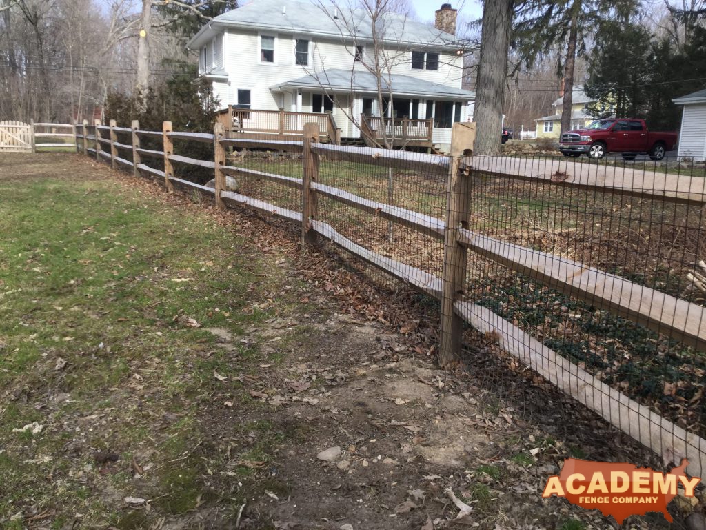 Post and rail with welded wire mesh attached installed by Academy Fence Company in West Orange, NJ. Essex County