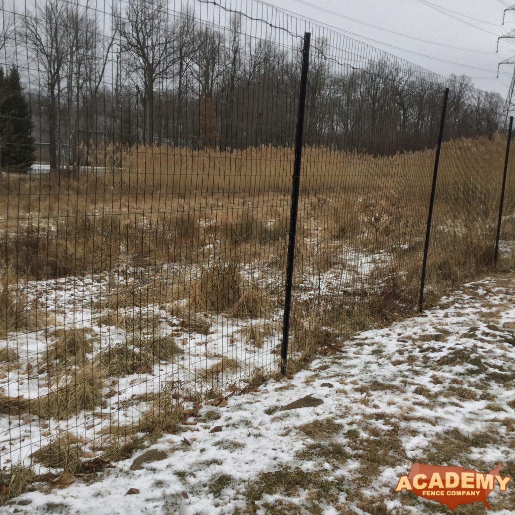 8′ high black wire deer fence installed in Watchung NJ, by Academy Fence Company.