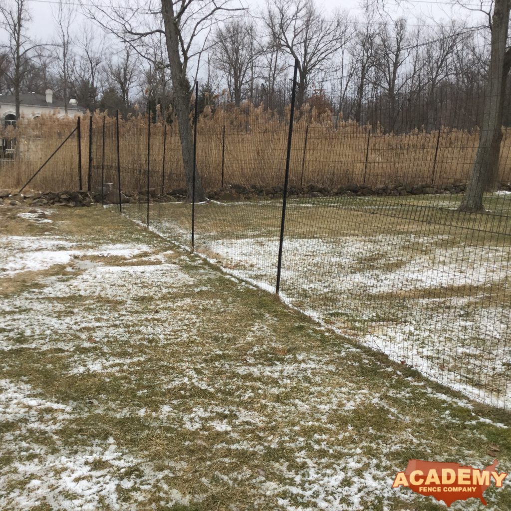 8′ black wire deer fence installed by Academy Fence Company in New Providence, NJ - Union County.