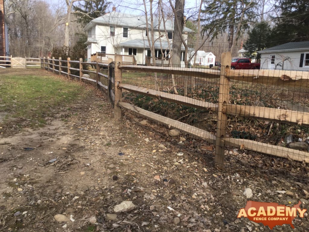 Post & rail with welded wire mesh attached installed by Academy Fence Company in Chester Township NJ, Morris County,