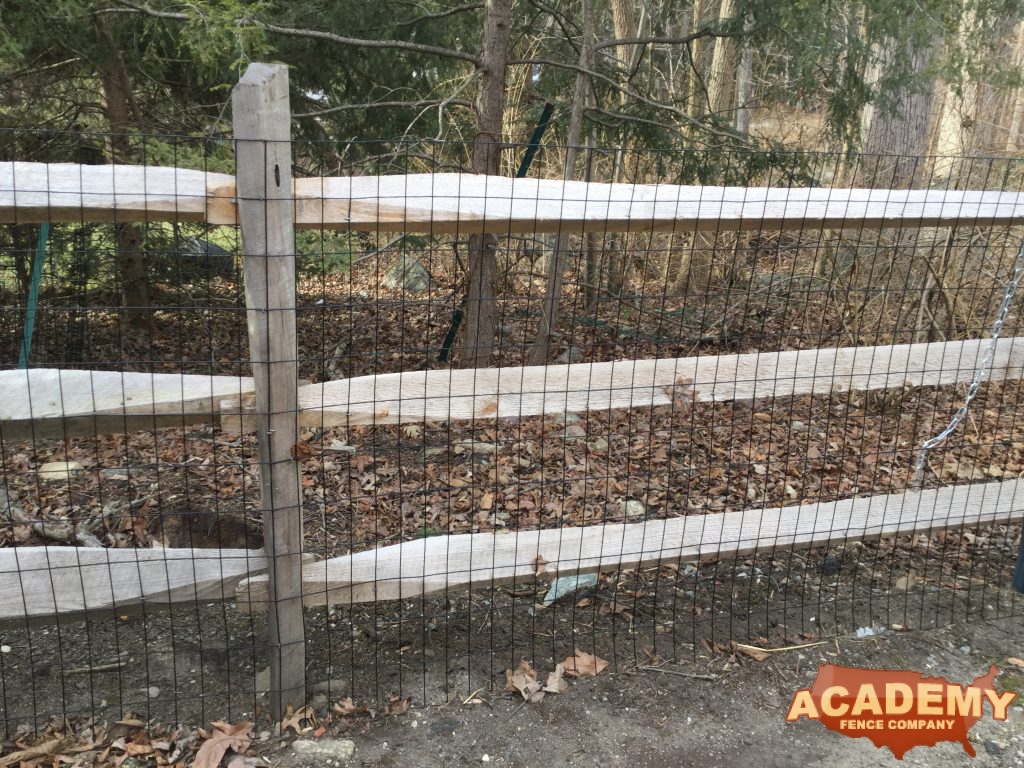 Post and rail with welded wire mesh attached, installed by Academy Fence Company in East Hanover, NJ.