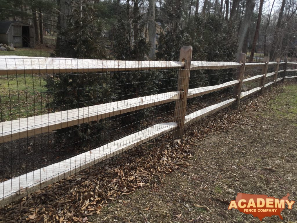 Post and rail with welded wire mesh attached, installed by Academy Fence Company in Hanover Township, NJ.