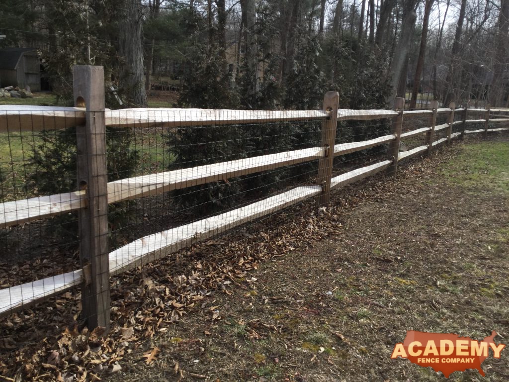 Post and rail with welded wire mesh attached, installed by Academy Fence Company in Lincoln Park, NJ.