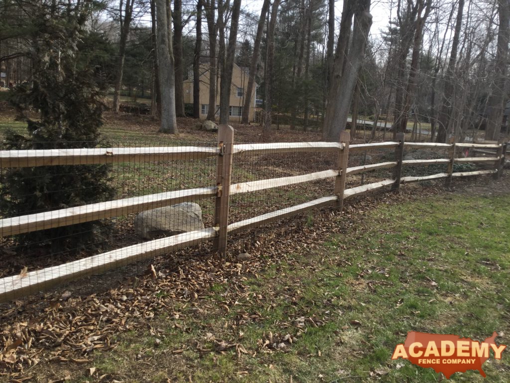 Post and rail with welded wire mesh attached, installed by Academy Fence Company in Madison, NJ.