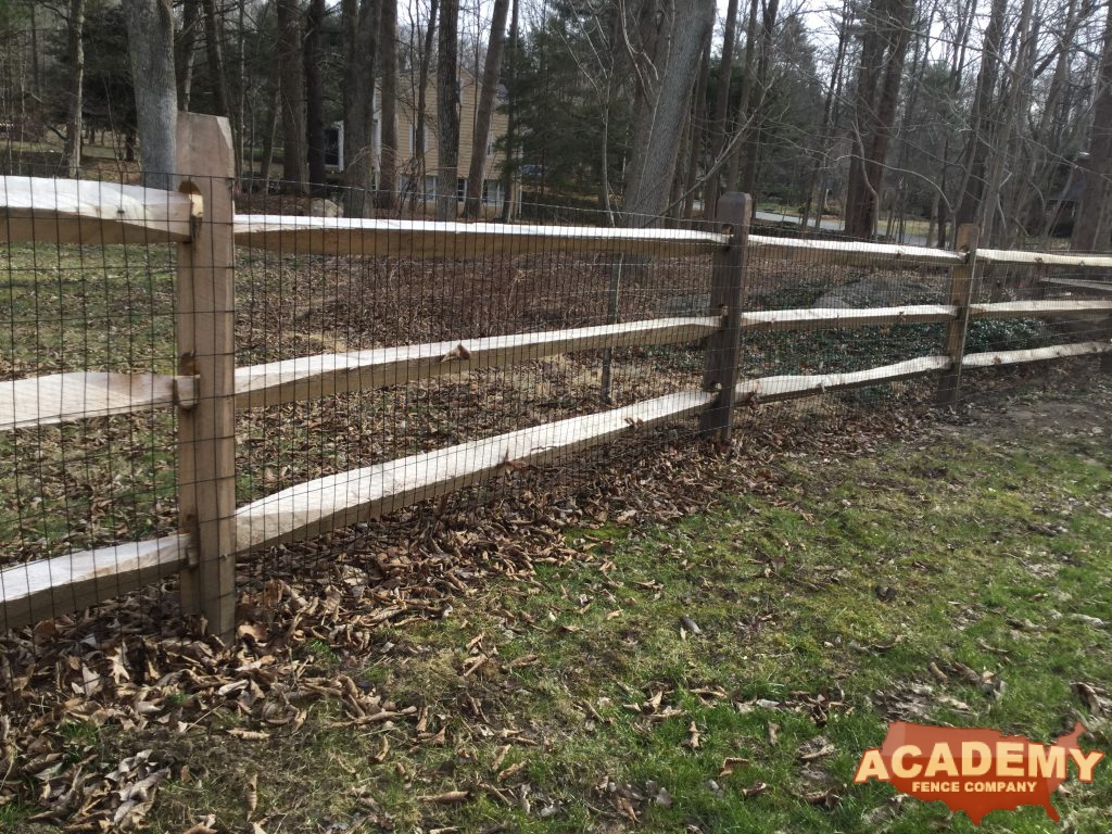 Post and rail with welded wire mesh attached, installed by Academy Fence Company in Mendham Township, NJ.