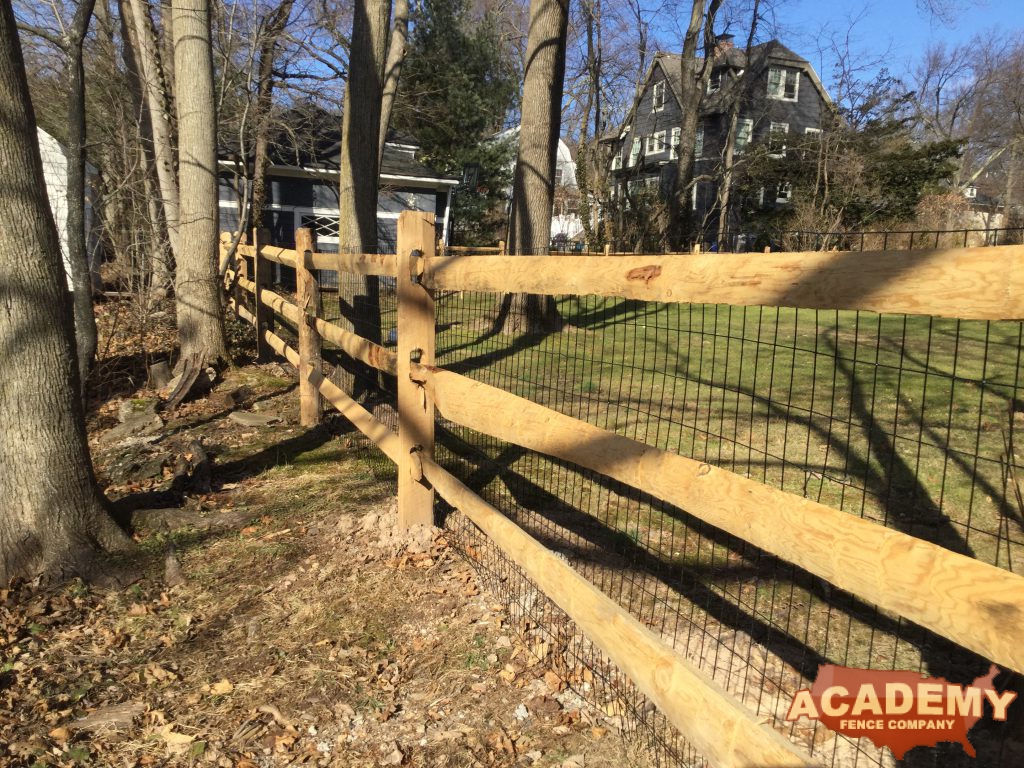 Post and rail with welded wire mesh attached, installed by Academy Fence Company in Morris township, NJ.