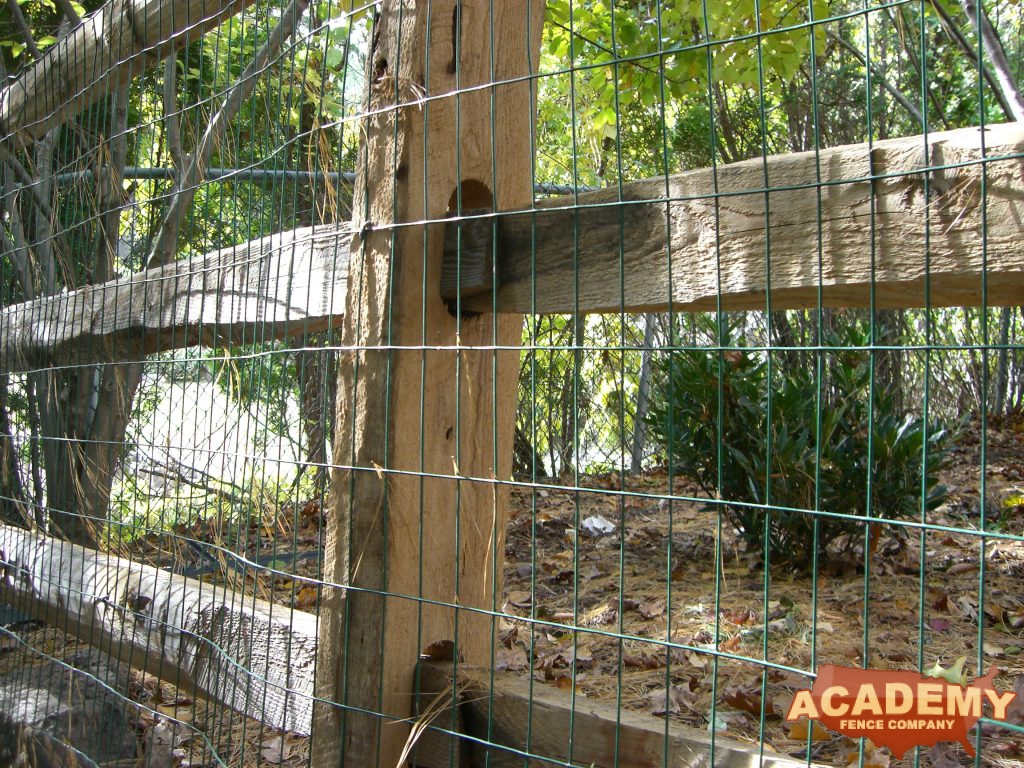 Post and rail with welded wire mesh attached, installed by Academy Fence Company in Parsippany-Troy Hills, NJ.