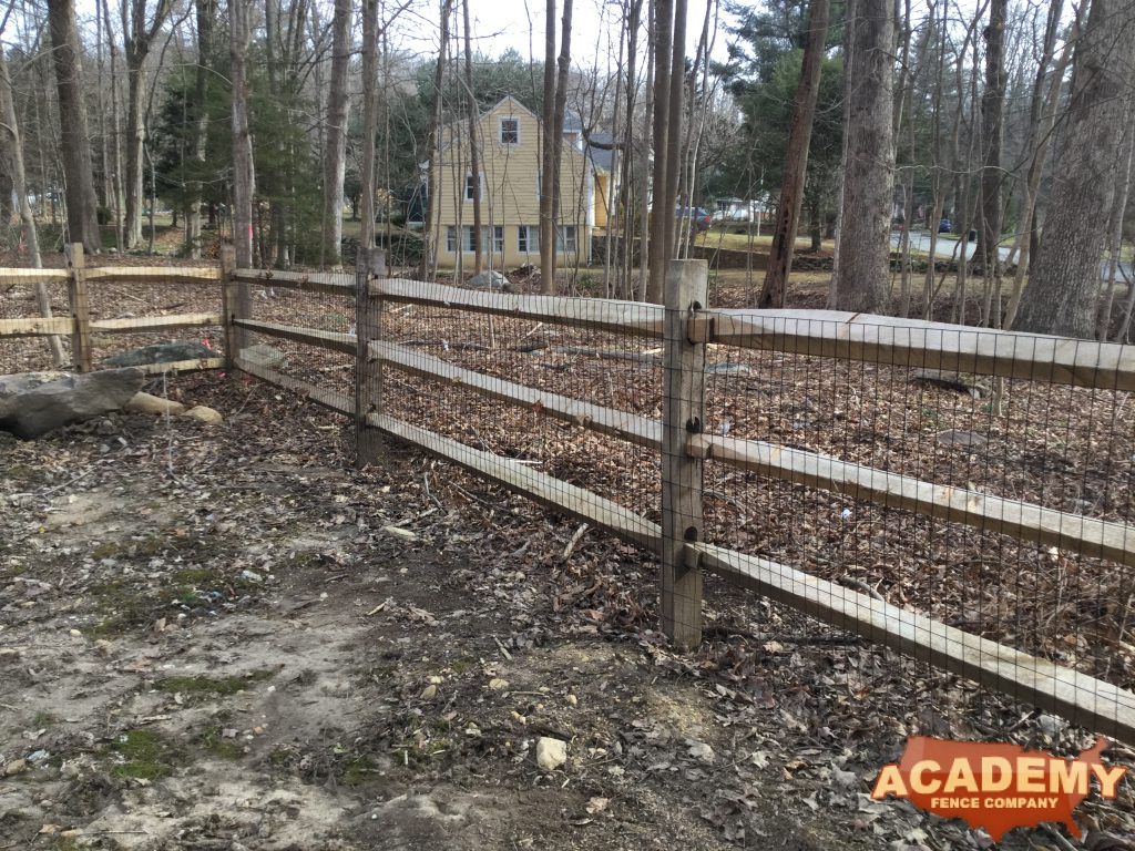 Post and rail with welded wire mesh attached installed by Academy Fence Company in Summit, NJ. Union County