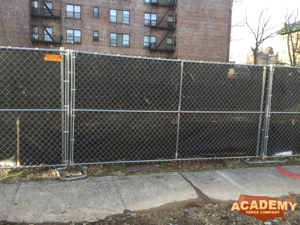 6' temporary chainlink construction fence panels installed by Academy Fence Company in Paterson, NJ.