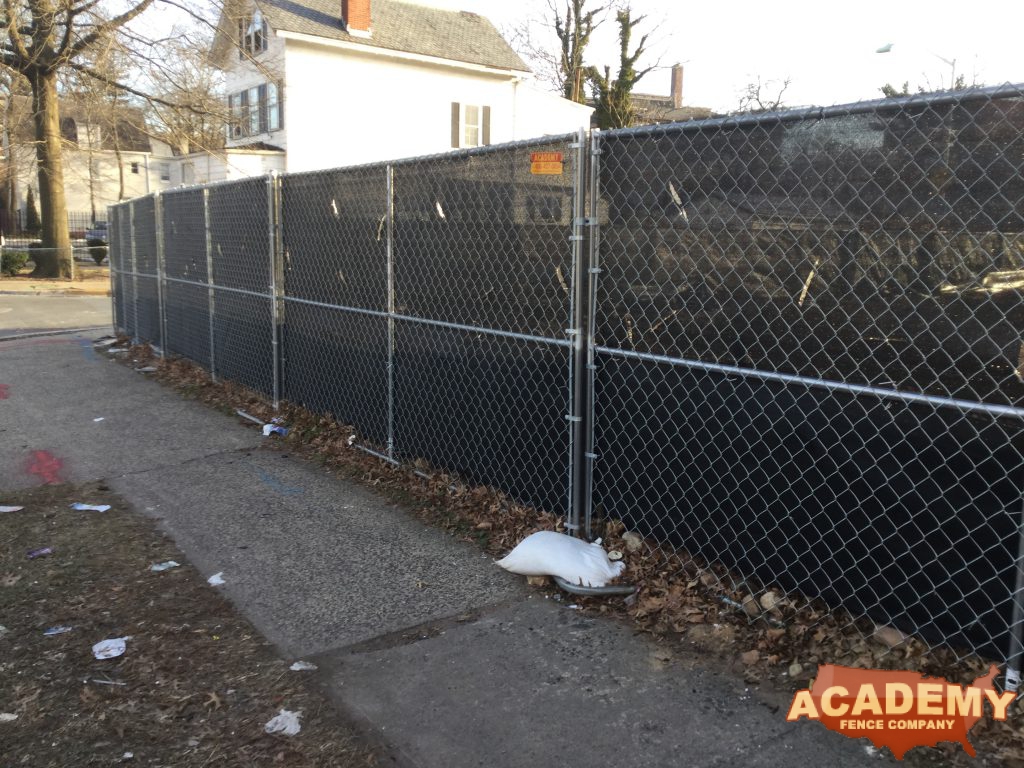 6' temporary chainlink construction fence panels installed by Academy Fence Company in Clifton, NJ.