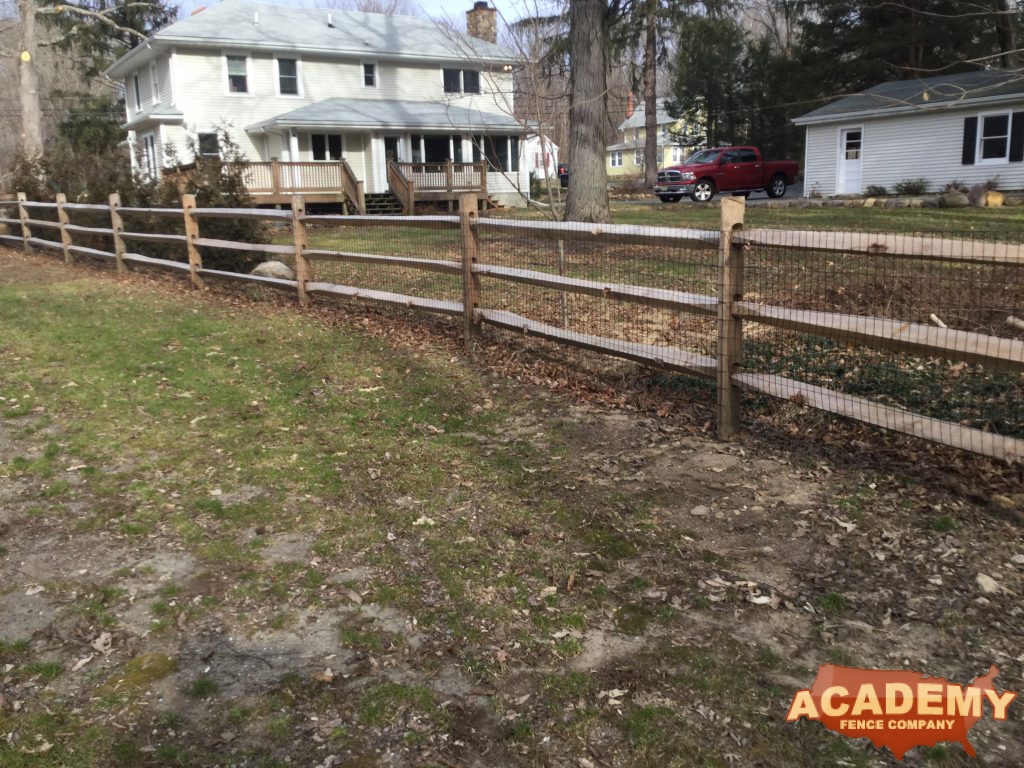 Picture of a post and rail wood fence with welded wire mesh attached, installed by Academy Fence Company in Short Hills (Millburn) , NJ, Essex County.